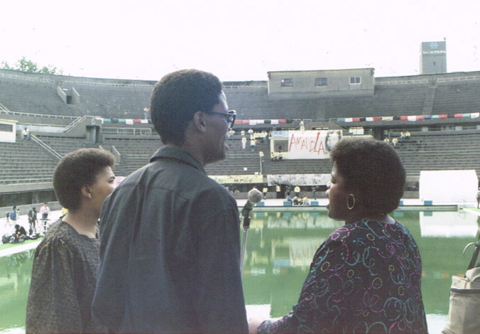 _ South African singers of the Amandla cultural ensemble rehearsing their songs on stage, as they look out over the empty seats of the Osaka Pool stadium this morning.  _ South African singers of the Amandla cultural ensemble rehearsing their songs on stage, as they look out over the empty seats of the Osaka Pool stadium this morning.