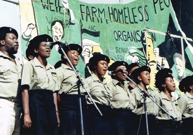 _ Amandla members singing a number during their stage show for the audience. This day was reportedly the first time for many in the troupe to see Nelson Mandela in person.  _ Amandla members singing a number during their stage show for the audience. This day was reportedly the first time for many in the troupe to see Nelson Mandela in person.