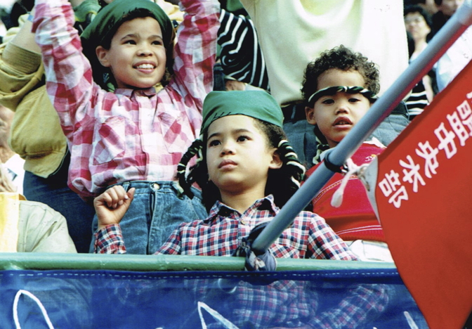 _ Three Japanese-South African siblings from Japan’s southern island of Kyushu take in the festivities. They had come with their mother Connie, a South African exile living in Japan.  _ Three Japanese-South African siblings from Japan’s southern island of Kyushu take in the festivities. They had come with their mother Connie, a South African exile living in Japan.