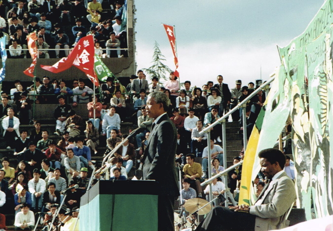 _ Mandela says he will meet with Japanese leaders in the coming days and “ask the government and business people in this country” for financial support. Seated behind Mandela is Jerry Matsila, the ANC representative in Tokyo.  _ Mandela says he will meet with Japanese leaders in the coming days and “ask the government and business people in this country” for financial support. Seated behind Mandela is Jerry Matsila, the ANC representative in Tokyo.