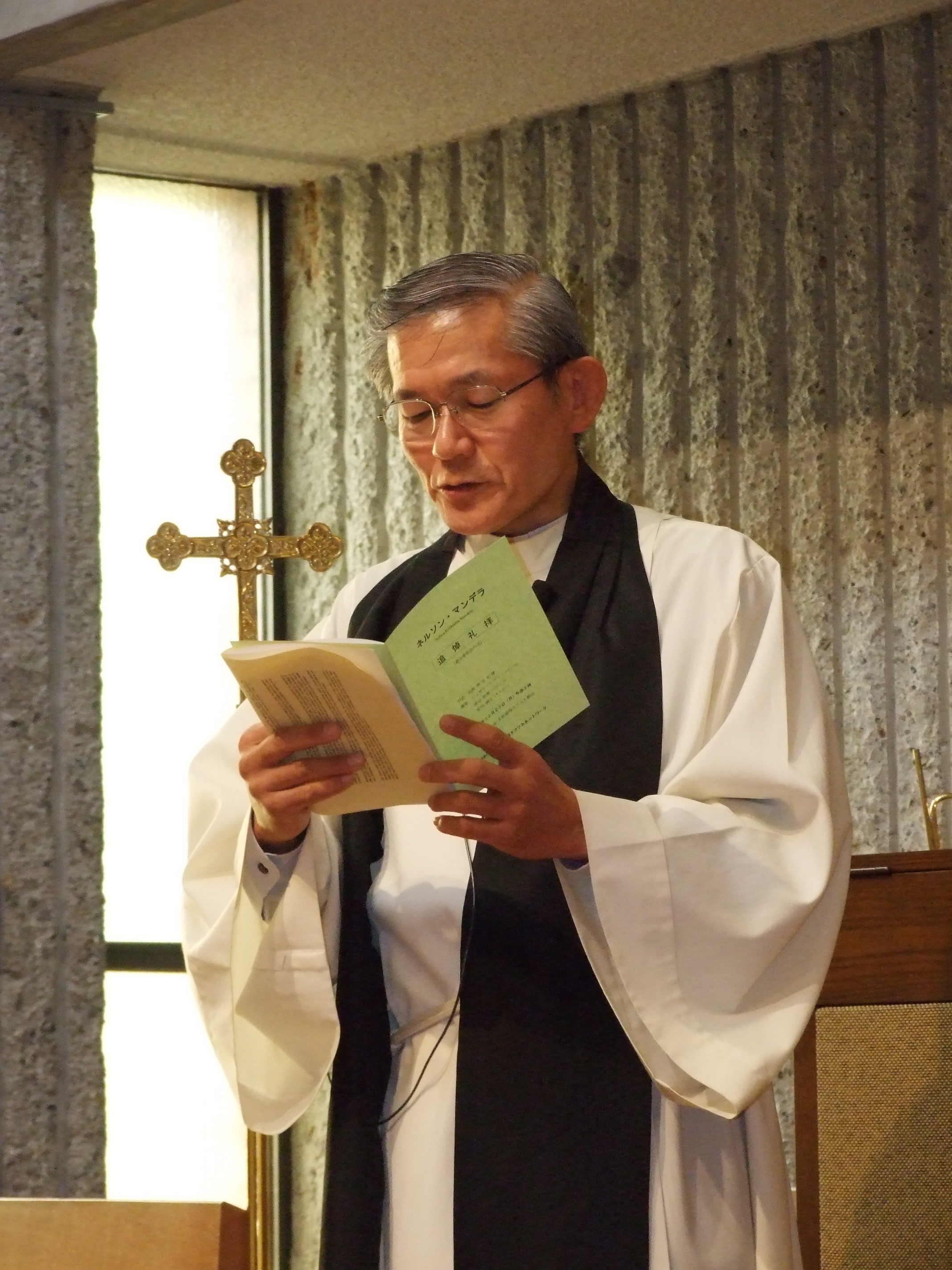 _ The formal service begins with a reading of passages from the Christian Bible by Mitsuo (“Poundcake”) Harada, pastor of the church.  _ The formal service begins with a reading of passages from the Christian Bible by Mitsuo (“Poundcake”) Harada, pastor of the church.