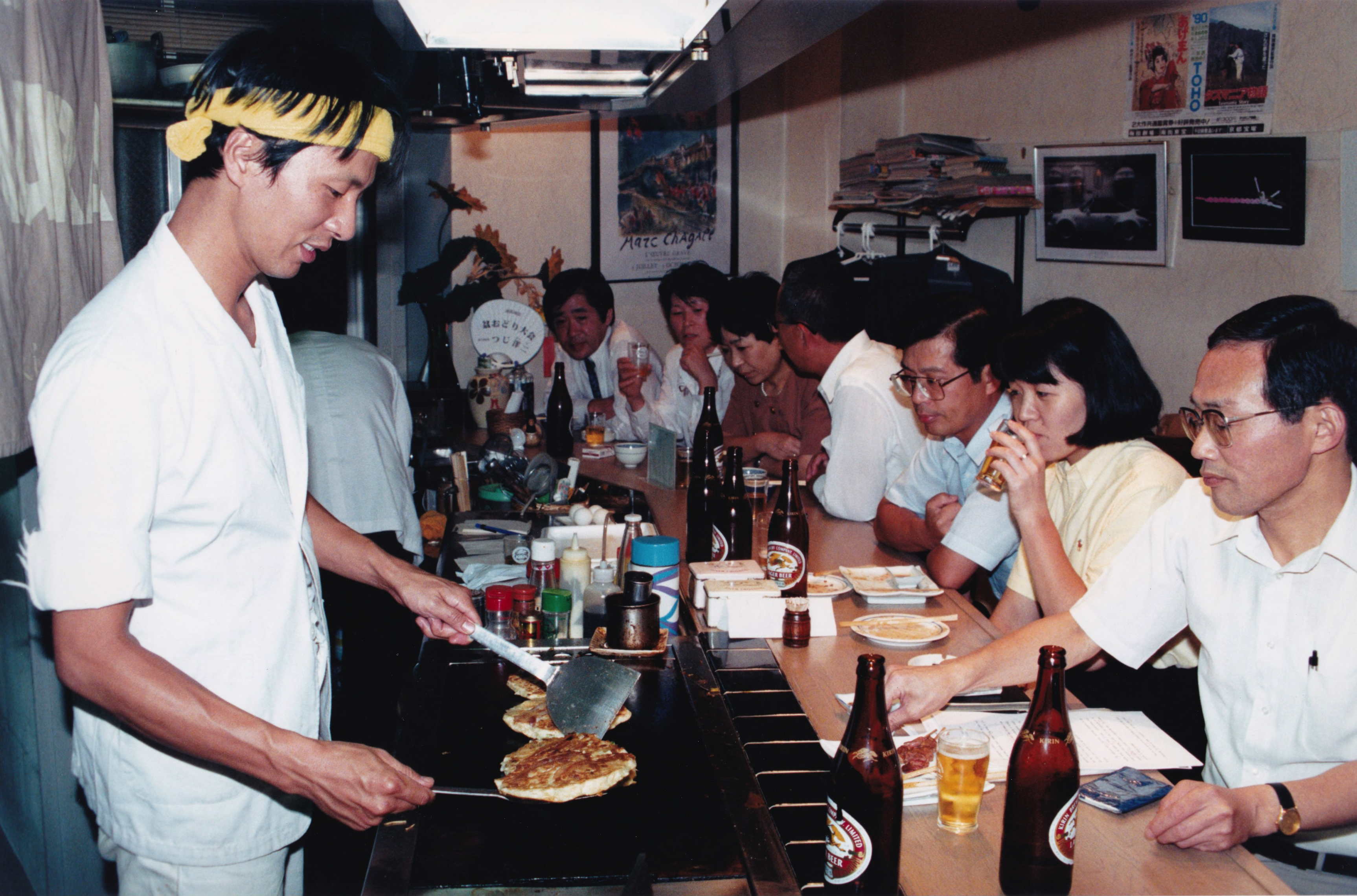 _ The busy day in Osaka ends, as Yasuhiro Nakamura serves up some savory okonomiyaki dishes to patrons in Namba on a hot summer night. Nakamura bar and grill, Chuo ward, Osaka.  _ The busy day in Osaka ends, as Yasuhiro Nakamura serves up some savory okonomiyaki dishes to patrons in Namba on a hot summer night. Nakamura bar and grill, Chuo ward, Osaka.